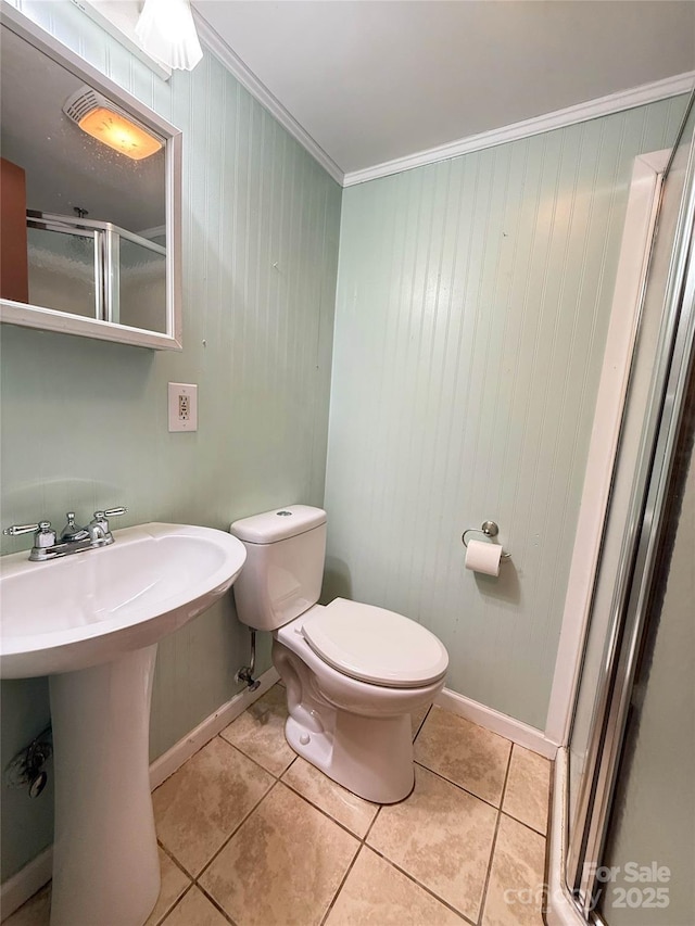 5685 Pine Ridge Dr, Connelly Springs, NC 28612 - full bathroom featuring tile patterned flooring, a shower stall, ornamental molding, and wooden walls