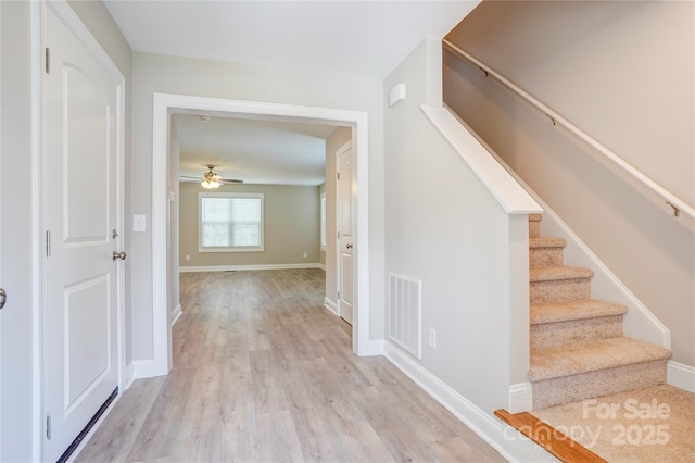 206 N Kayla Dr, Salisbury, NC 28146 - foyer entrance featuring ceiling fan, wood finished floors, and stairway