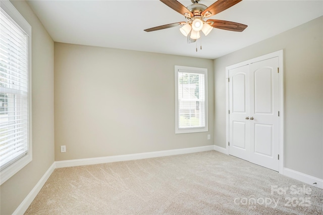 206 N Kayla Dr, Salisbury, NC 28146 - unfurnished bedroom with carpet flooring, a closet, and a ceiling fan