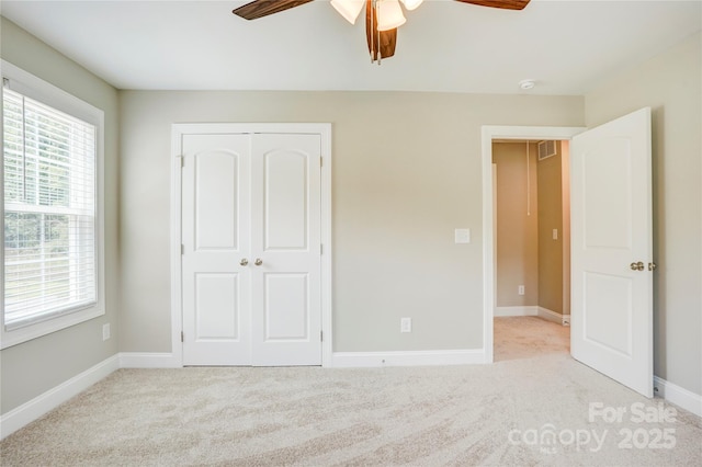 206 N Kayla Dr, Salisbury, NC 28146 - unfurnished bedroom featuring carpet, a closet, and a ceiling fan