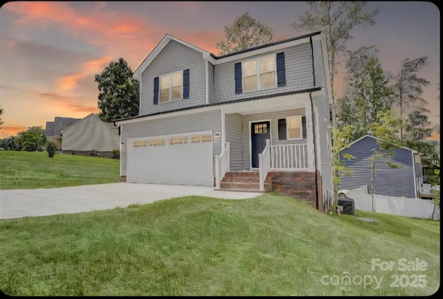 206 N Kayla Dr, Salisbury, NC 28146 - traditional-style house with a garage, a lawn, covered porch, and concrete driveway