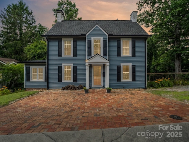 321 Ehringhaus St, Hendersonville, NC 28739 - colonial house featuring a chimney