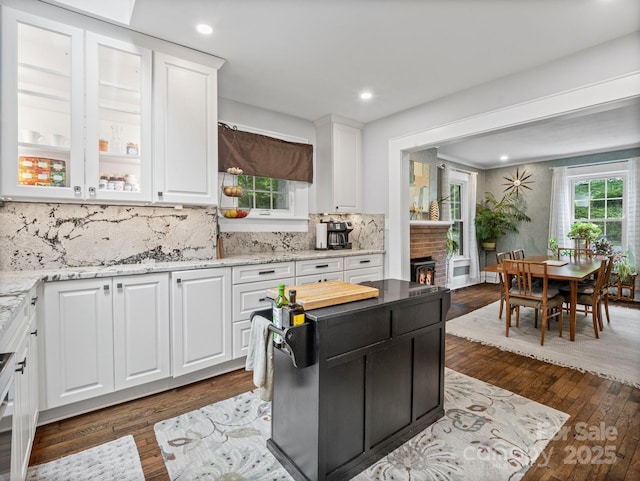 321 Ehringhaus St, Hendersonville, NC 28739 - kitchen featuring white cabinetry, backsplash, dark wood-style flooring, light stone counters, and recessed lighting