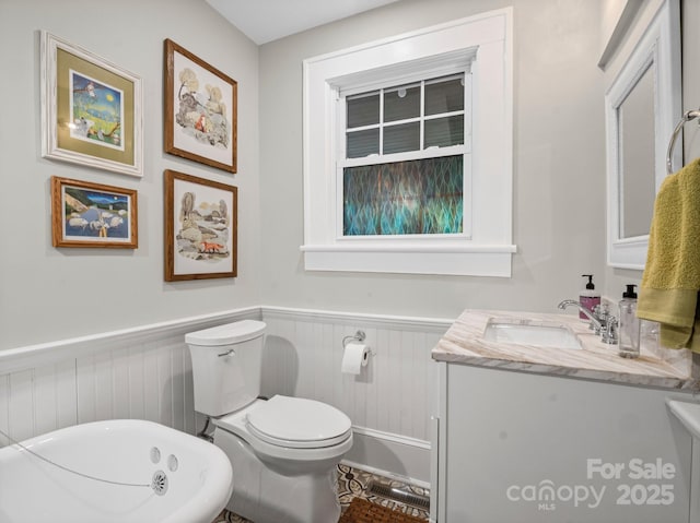321 Ehringhaus St, Hendersonville, NC 28739 - bathroom with vanity, a wainscoted wall, and a bathtub