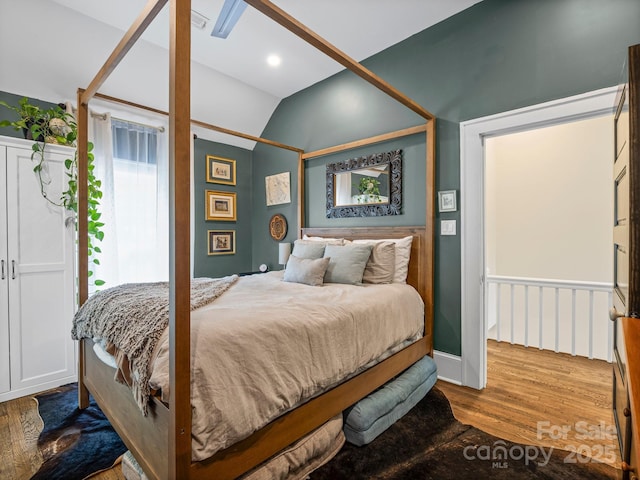 321 Ehringhaus St, Hendersonville, NC 28739 - bedroom featuring vaulted ceiling and wood finished floors