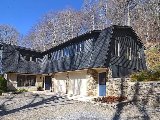 617 Norton Fork Rd, Hot Springs, NC 28743 - view of front of home featuring stone siding, a shingled roof, and an attached garage