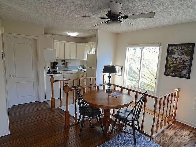 617 Norton Fork Rd, Hot Springs, NC 28743 - dining room with dark wood-style flooring, a ceiling fan, and a textured ceiling