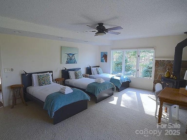 617 Norton Fork Rd, Hot Springs, NC 28743 - bedroom with carpet floors, a ceiling fan, and a textured ceiling