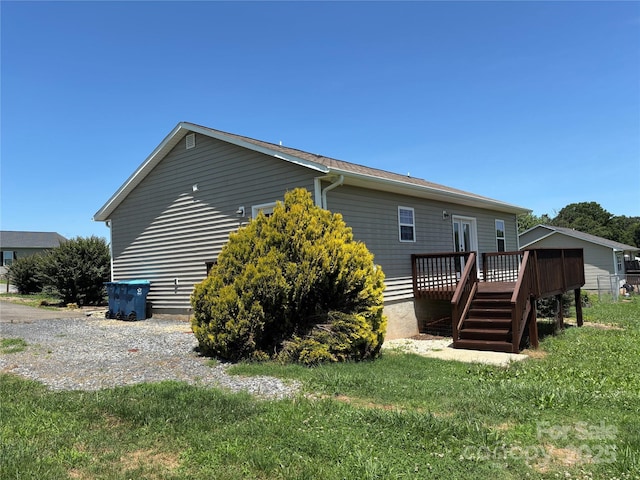 72 Helens Way, Taylorsville, NC 28681 - view of home's exterior featuring a deck and a lawn