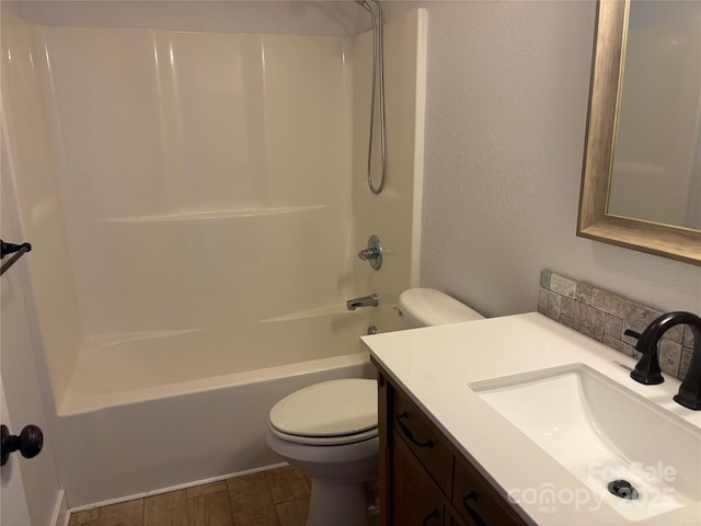 72 Helens Way, Taylorsville, NC 28681 - full bath with vanity, wood finished floors,  shower combination, and decorative backsplash
