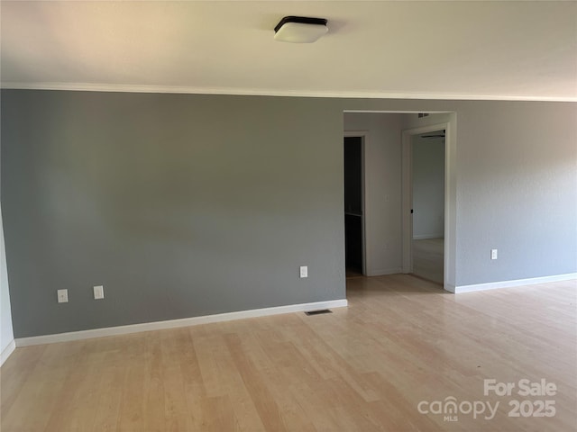 72 Helens Way, Taylorsville, NC 28681 - spare room featuring light wood-style flooring and ornamental molding