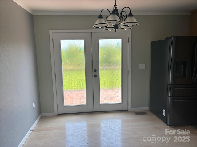 72 Helens Way, Taylorsville, NC 28681 - doorway featuring a chandelier, french doors, light wood-style flooring, and crown molding