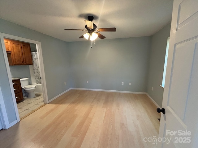 72 Helens Way, Taylorsville, NC 28681 - unfurnished bedroom with light wood-type flooring, ensuite bath, and a ceiling fan