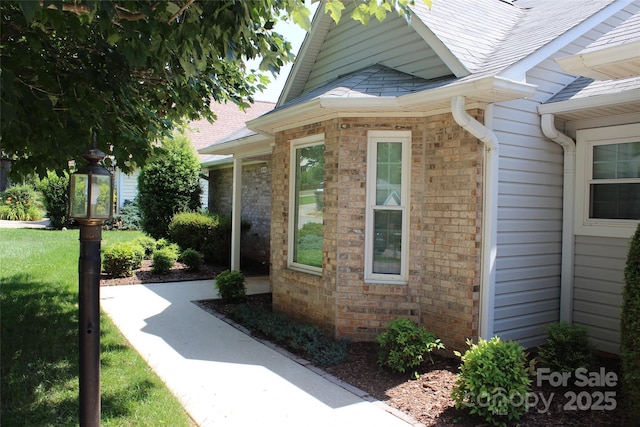 4 Gatehouse Ct, Asheville, NC 28803 - view of exterior entry with brick siding and roof with shingles