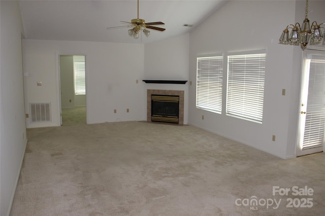 4 Gatehouse Ct, Asheville, NC 28803 - unfurnished living room featuring vaulted ceiling, a chandelier, carpet flooring, a fireplace, and a ceiling fan