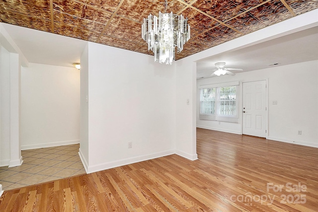 8062 Knights Bridge Rd, Charlotte, NC 28210 - spare room featuring an ornate ceiling, a chandelier, light wood finished floors, and ceiling fan