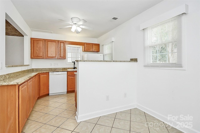 8062 Knights Bridge Rd, Charlotte, NC 28210 - kitchen featuring white dishwasher, ceiling fan, light tile patterned floors, and light stone counters