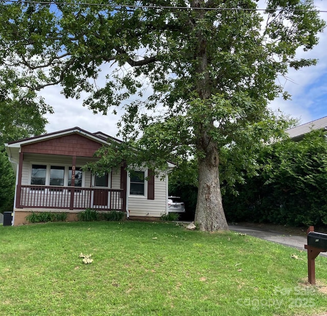 615 Marietta St, Asheville, NC 28803 - view of front of property with covered porch and a front yard
