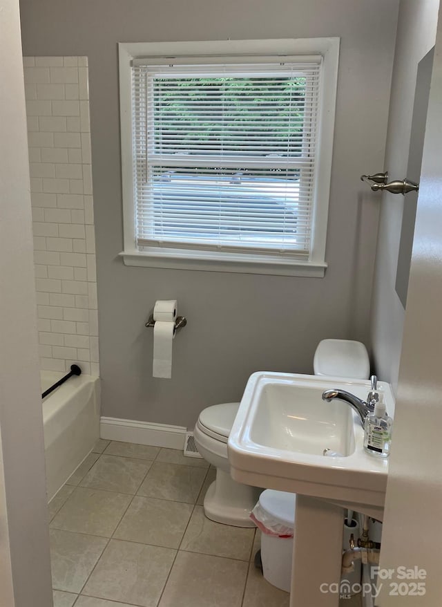 615 Marietta St, Asheville, NC 28803 - bathroom with tile patterned floors and toilet