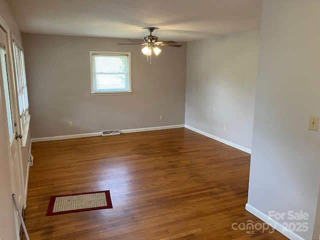 615 Marietta St, Asheville, NC 28803 - empty room featuring wood finished floors and a ceiling fan