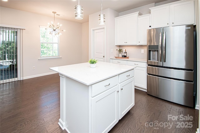 17718 Terryglass Ln, Charlotte, NC 28278 - kitchen featuring stainless steel fridge with ice dispenser, dark wood-style floors, light countertops, and a kitchen island