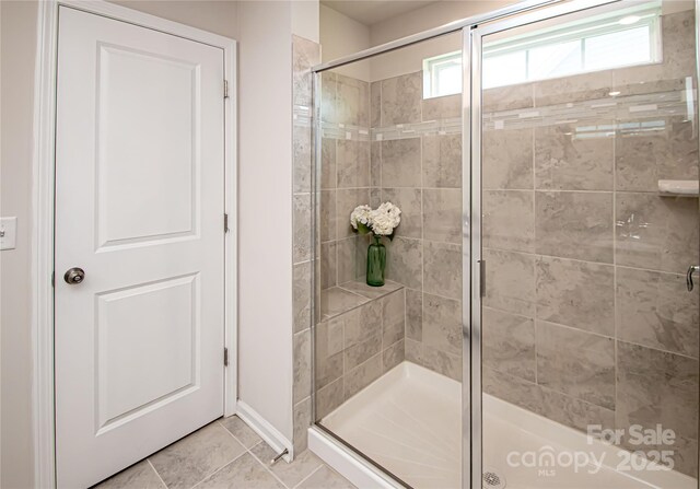 17718 Terryglass Ln, Charlotte, NC 28278 - bathroom featuring a stall shower and tile patterned flooring