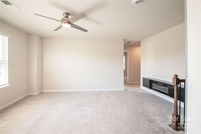 17718 Terryglass Ln, Charlotte, NC 28278 - spare room featuring light carpet, a ceiling fan, and healthy amount of natural light