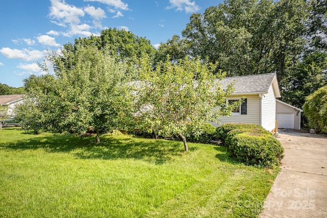 3427 Wonderland Dr, Matthews, NC 28104 - obstructed view of property with a front lawn, a shingled roof, and an outdoor structure
