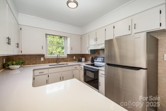 3427 Wonderland Dr, Matthews, NC 28104 - kitchen with freestanding refrigerator, range with electric stovetop, under cabinet range hood, tasteful backsplash, and light countertops