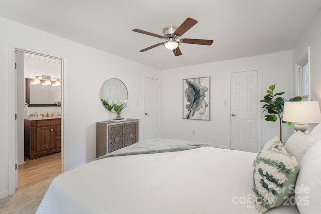 3427 Wonderland Dr, Matthews, NC 28104 - bedroom featuring ensuite bath, light colored carpet, and a ceiling fan