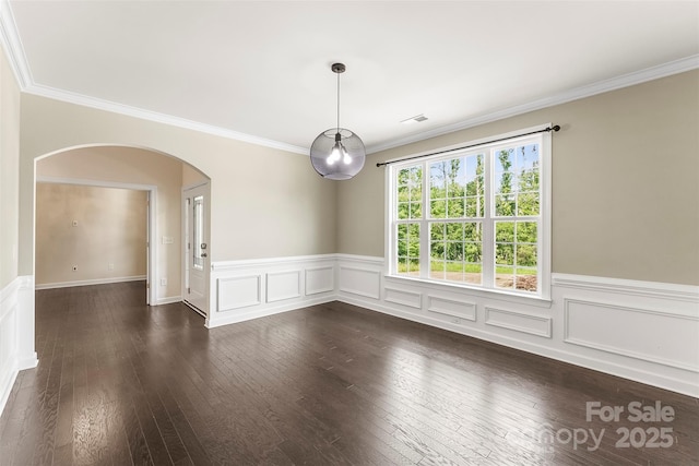 2525 Surveyor General Dr, Waxhaw, NC 28173 - empty room featuring arched walkways, ornamental molding, dark wood-style flooring, a wainscoted wall, and a decorative wall