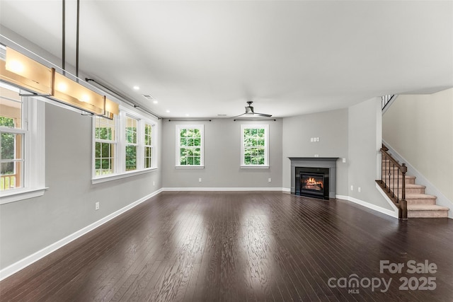 2525 Surveyor General Dr, Waxhaw, NC 28173 - unfurnished living room with a fireplace with flush hearth, dark wood-style floors, stairway, and recessed lighting