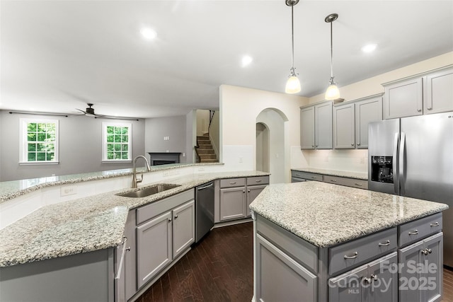2525 Surveyor General Dr, Waxhaw, NC 28173 - kitchen with gray cabinets, stainless steel appliances, ceiling fan, dark wood-type flooring, and recessed lighting