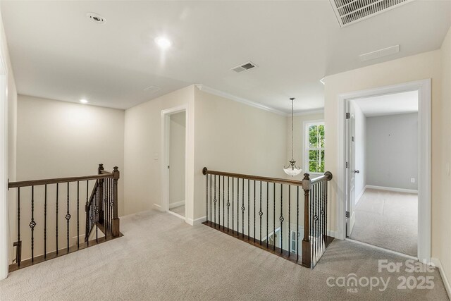 2525 Surveyor General Dr, Waxhaw, NC 28173 - hall with an upstairs landing, carpet flooring, recessed lighting, and crown molding