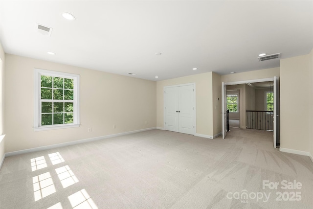2525 Surveyor General Dr, Waxhaw, NC 28173 - spare room featuring light colored carpet, plenty of natural light, and recessed lighting