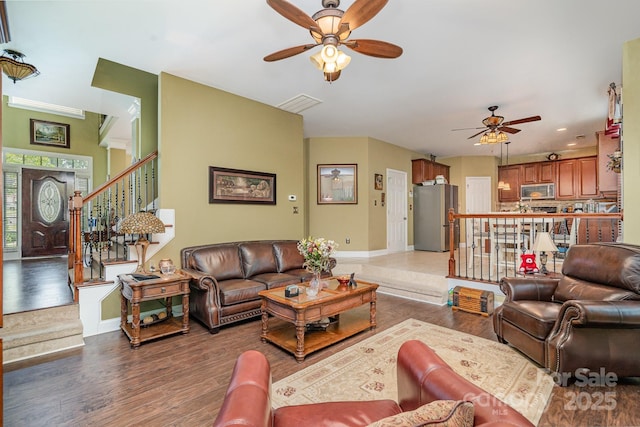 10812 Clark St, Davidson, NC 28036 - living area with ceiling fan, wood finished floors, stairs, and recessed lighting