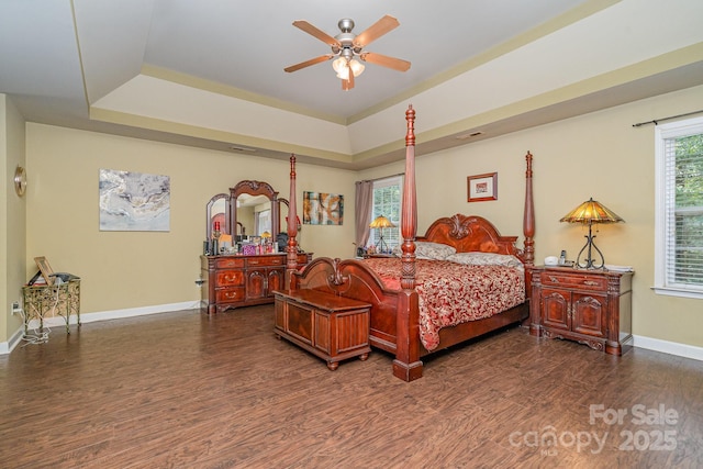 10812 Clark St, Davidson, NC 28036 - bedroom featuring wood finished floors, a raised ceiling, and a ceiling fan