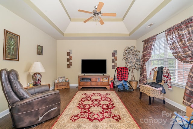 10812 Clark St, Davidson, NC 28036 - living room with a tray ceiling, dark wood-style flooring, and ceiling fan