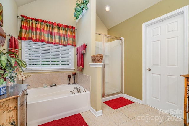 10812 Clark St, Davidson, NC 28036 - bathroom featuring vaulted ceiling, a bath, tile patterned flooring, a shower stall, and recessed lighting