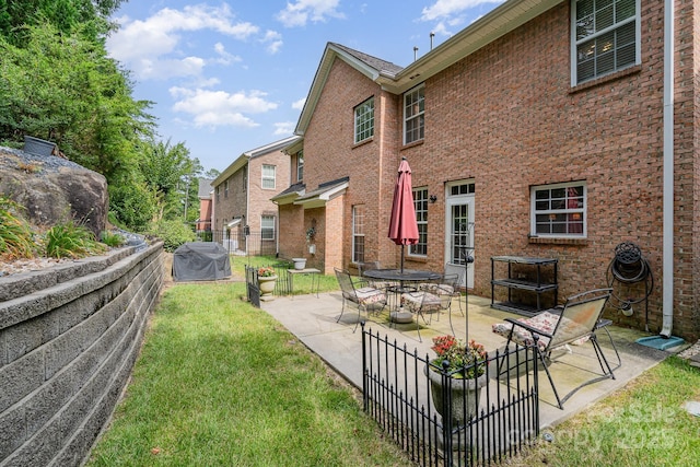 10812 Clark St, Davidson, NC 28036 - back of house featuring a patio and brick siding