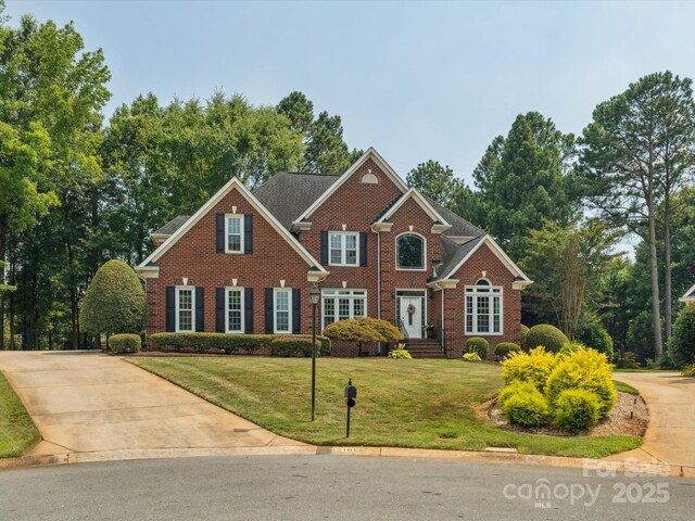 13101 Kensworth Ct, Charlotte, NC 28277 - view of front of home with a front yard, brick siding, and concrete driveway