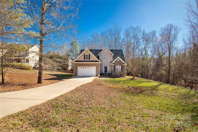 4114 Flint Dr, Lancaster, SC 29720 - traditional home with concrete driveway, brick siding, a front yard, and a garage