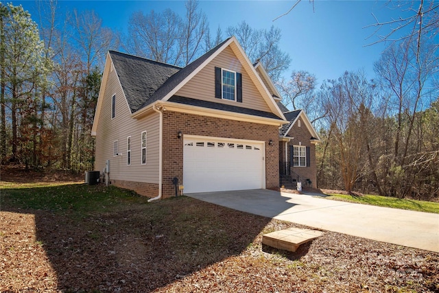 4114 Flint Dr, Lancaster, SC 29720 - view of front of house with driveway, an attached garage, a shingled roof, and brick siding