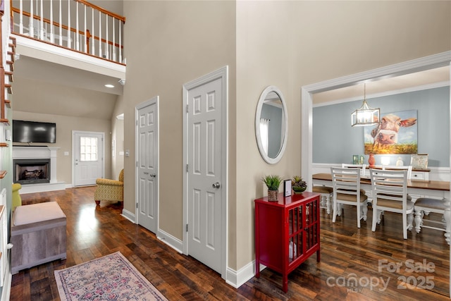 4114 Flint Dr, Lancaster, SC 29720 - foyer entrance featuring a high ceiling, hardwood / wood-style flooring, and a fireplace with raised hearth