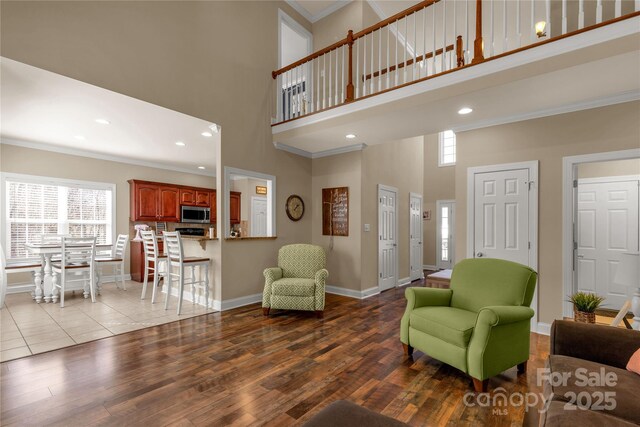 4114 Flint Dr, Lancaster, SC 29720 - living area with a high ceiling, wood finished floors, crown molding, and recessed lighting