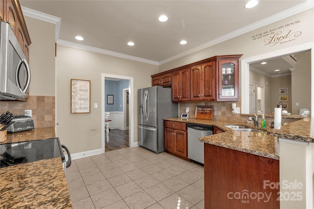 4114 Flint Dr, Lancaster, SC 29720 - kitchen with stainless steel appliances, crown molding, light tile patterned floors, decorative backsplash, and light stone counters