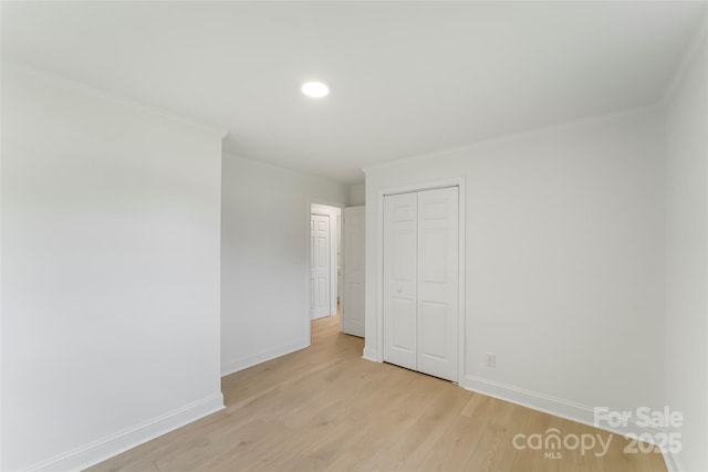 4146 Old State Rd, Newton, NC 28658 - unfurnished bedroom with a closet, light wood-style flooring, ornamental molding, and recessed lighting