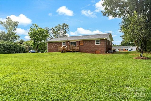 4146 Old State Rd, Newton, NC 28658 - back of property featuring a wooden deck, brick siding, and a lawn