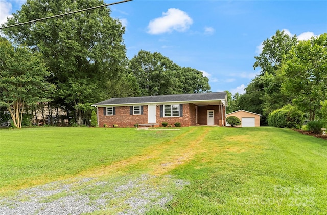 4146 Old State Rd, Newton, NC 28658 - ranch-style home featuring an outdoor structure, a front lawn, a detached garage, and brick siding