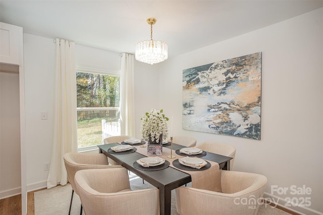 8025 Cliffside Dr, Charlotte, NC 28270 - dining area with a chandelier and wood finished floors